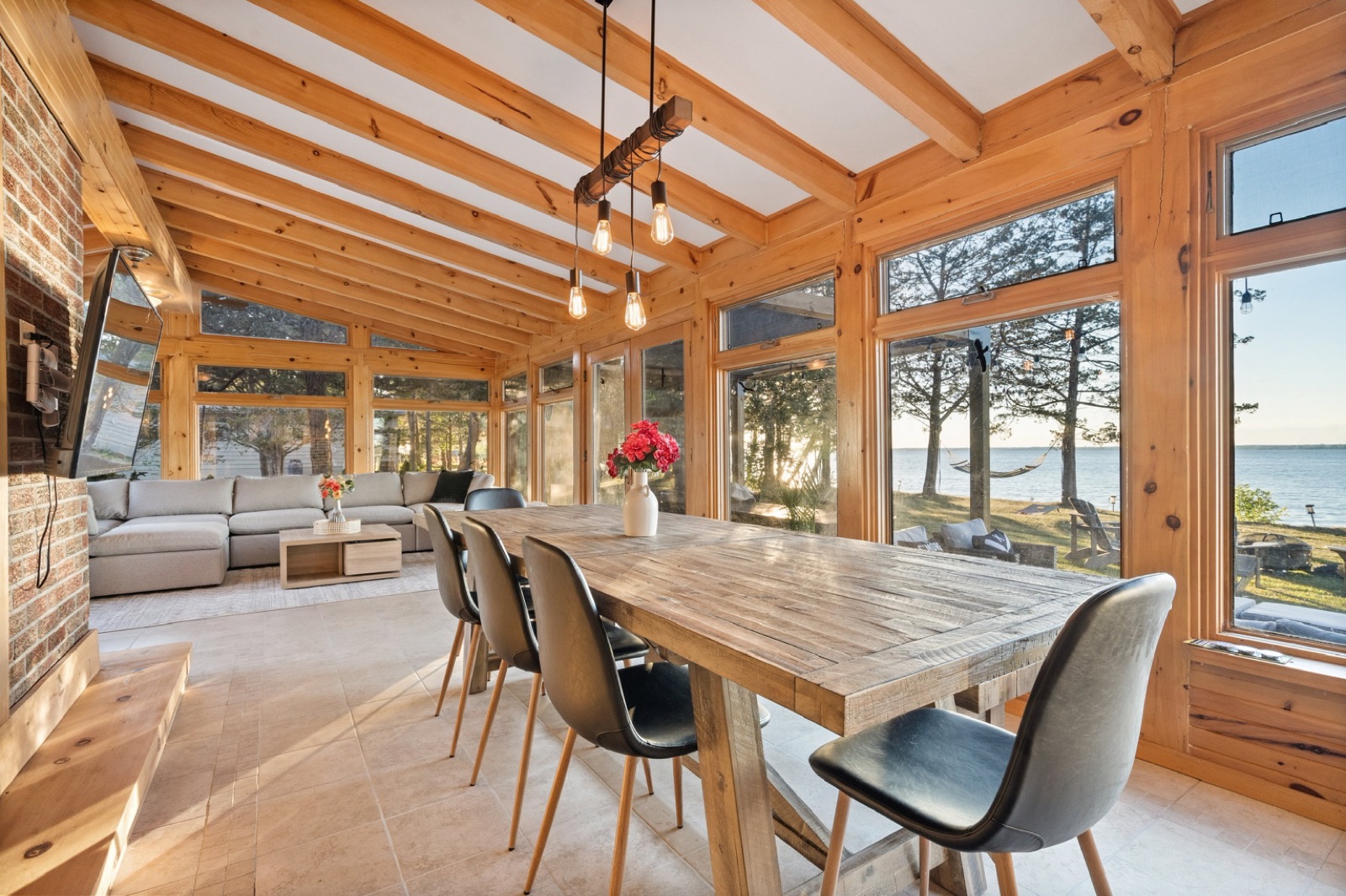 Sunroom dining table with a view of the water