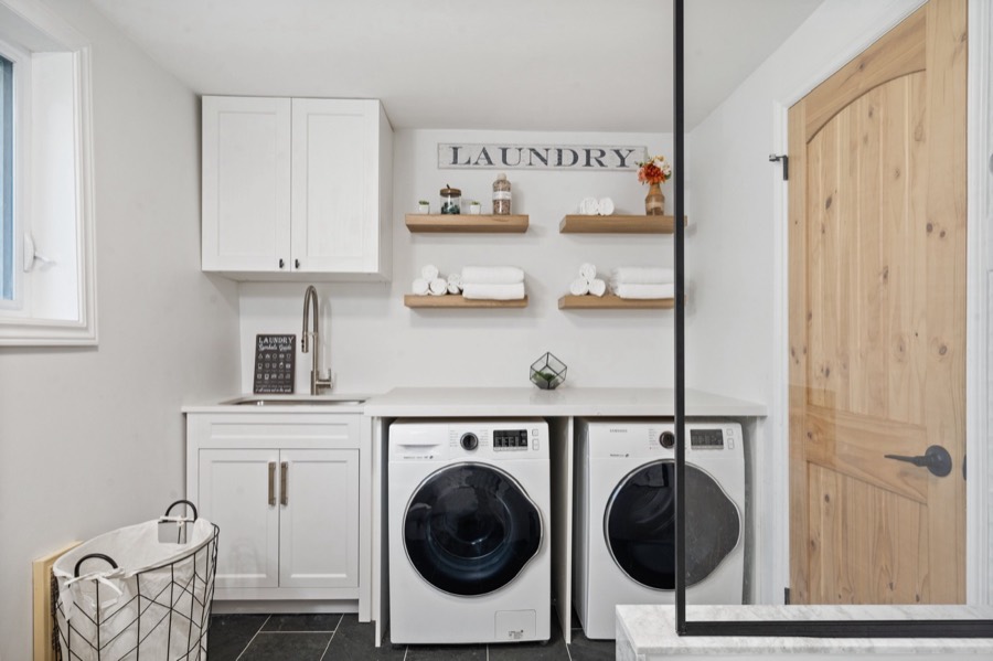 Laundry room with washer, dryer, sink and fresh towels