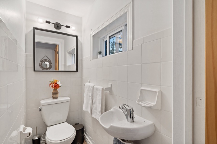Half bathroom with a corner sink